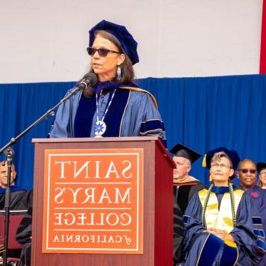  Dr. Karina Walters of the National Institutes of Health giving the commencement address at the podium